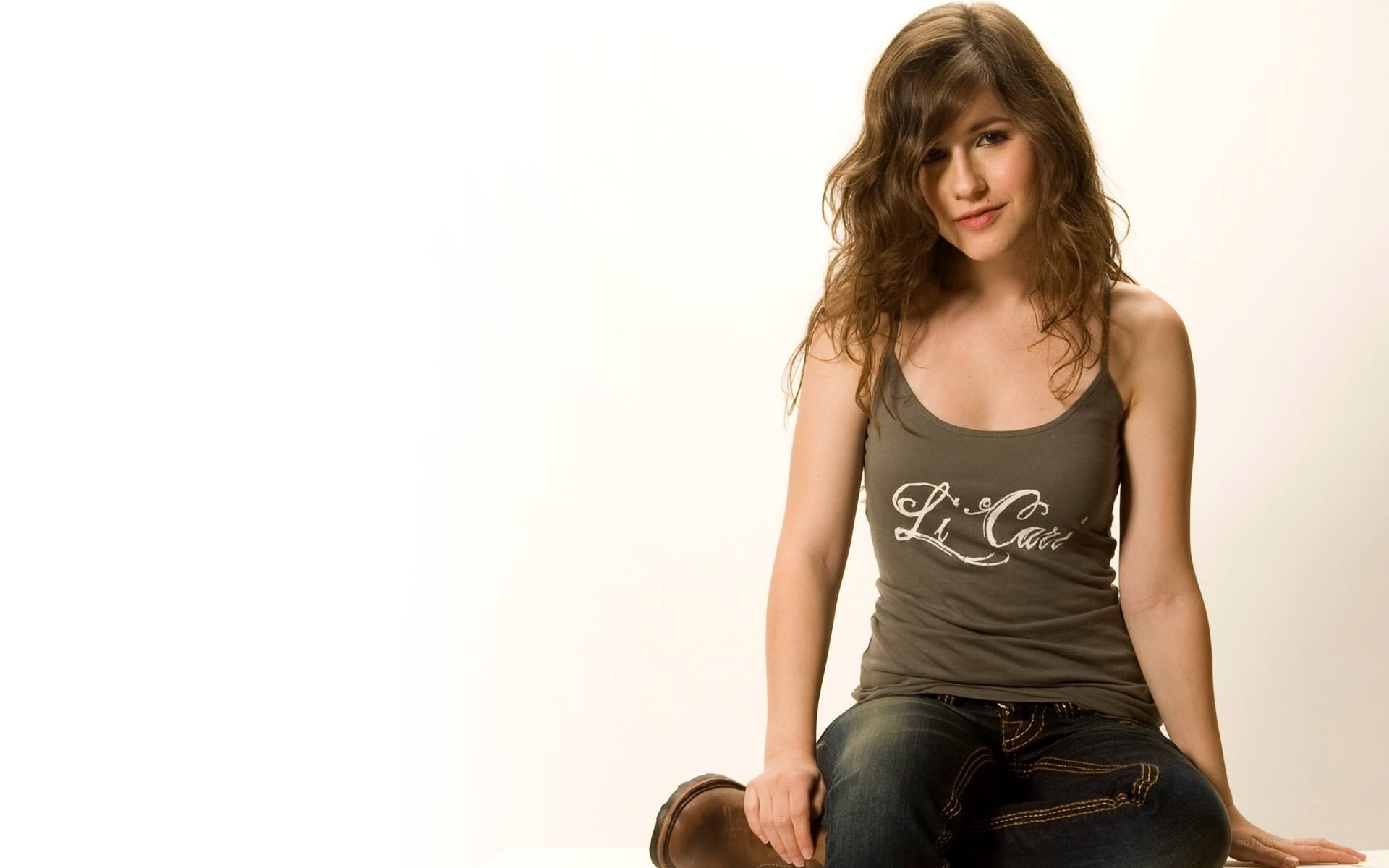 woman in tank top sitting