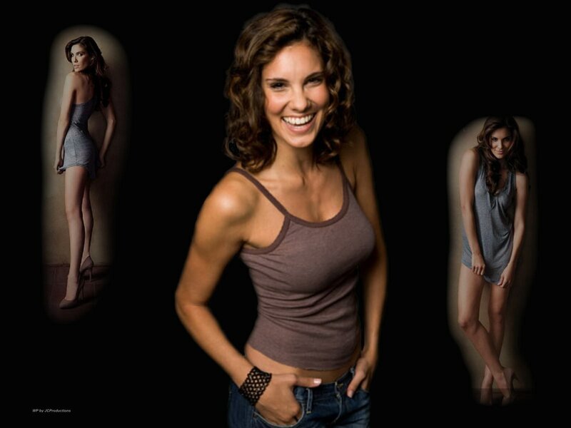woman in tank top smiling