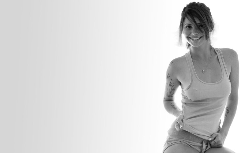 woman in tank top smiling