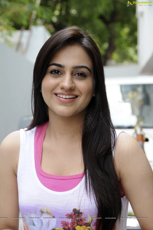woman in tank top smiling