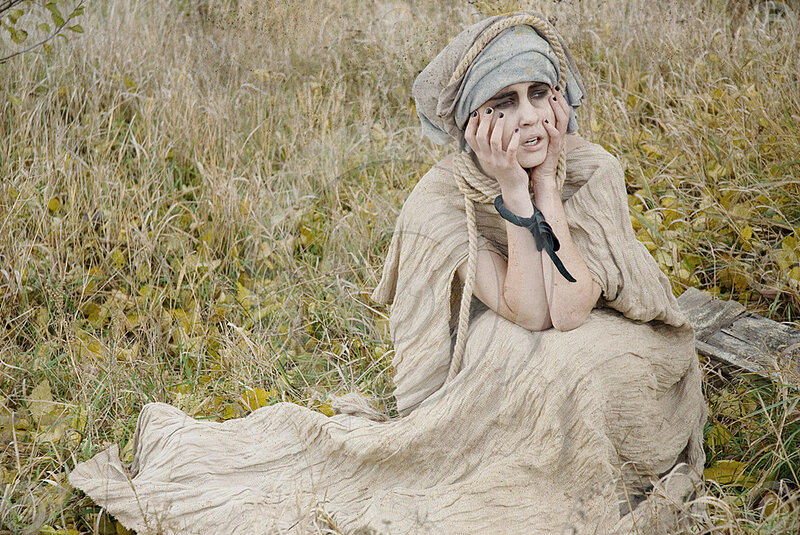 Woman in Tattered Clothes
