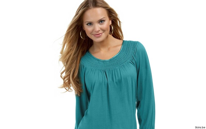 woman in teal blouse