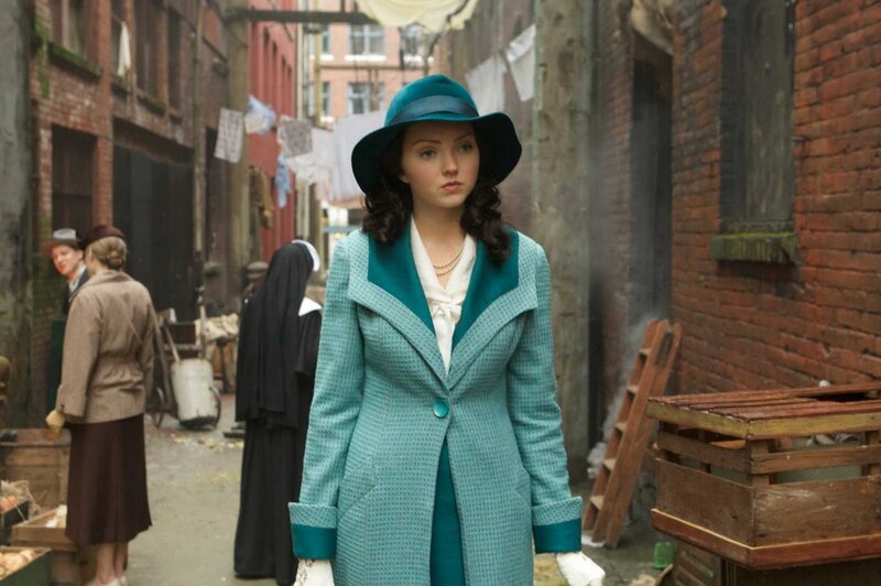 Woman in Teal Coat