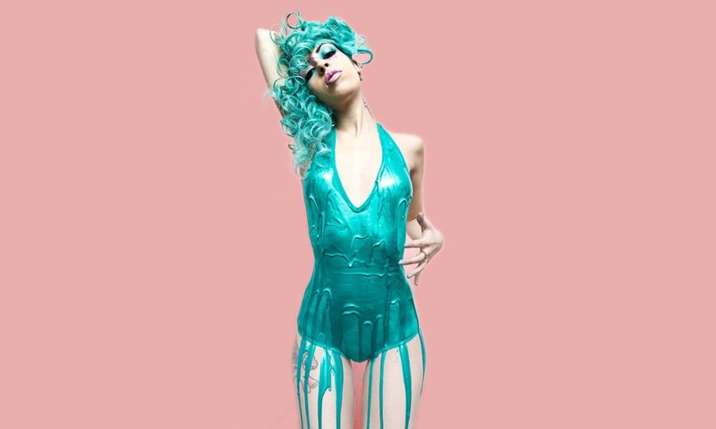 woman in teal costume