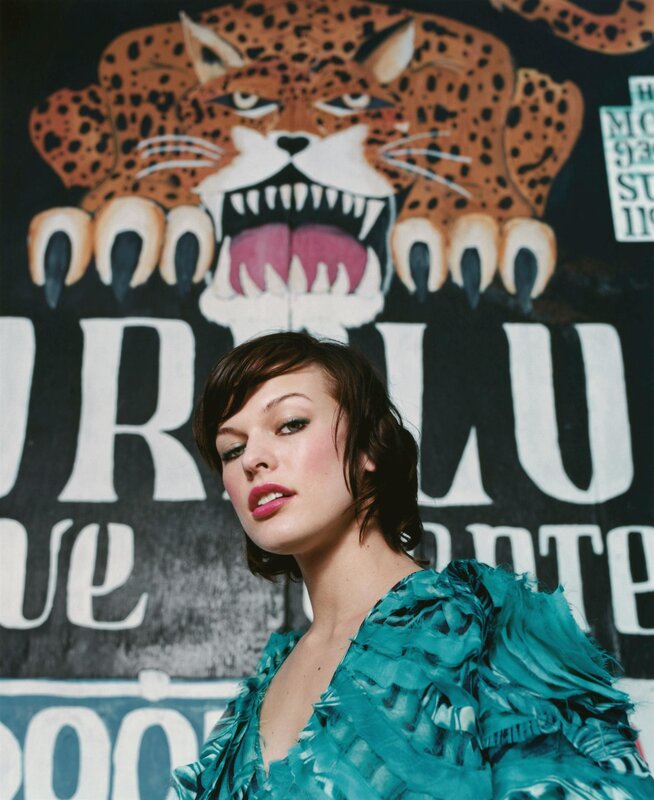 Woman in teal dress with leopard art