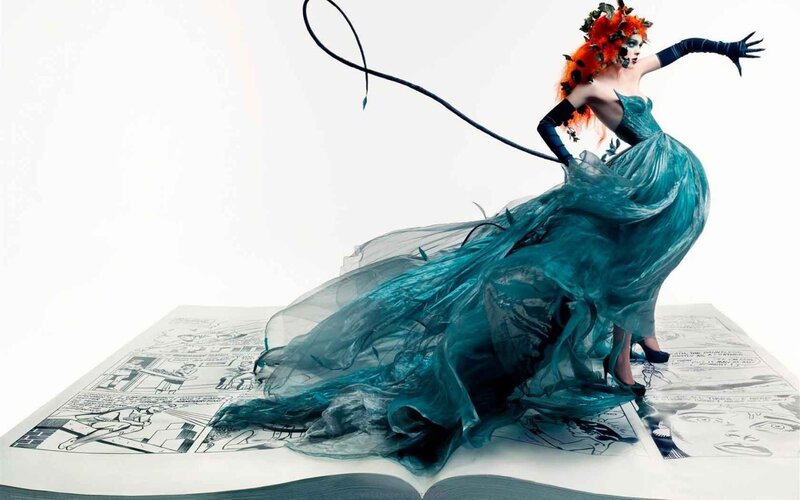 woman in teal gown on comic book