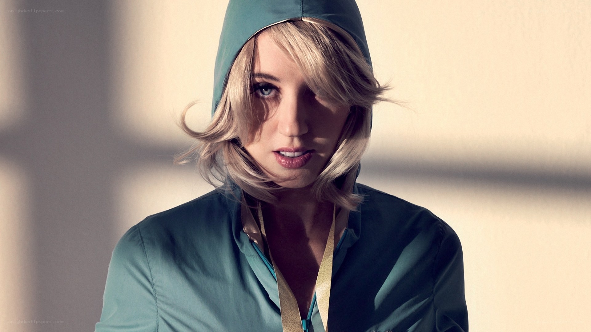 woman in teal hooded jacket