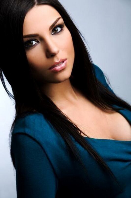woman in teal top