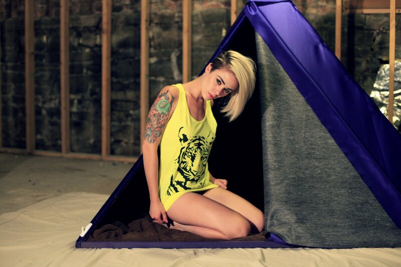 Woman in tent with tattoo