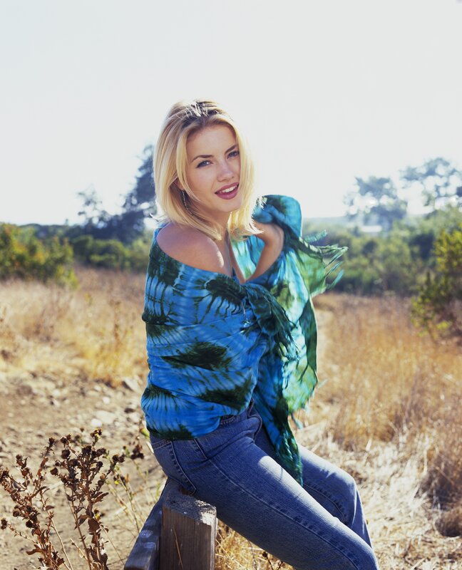 woman in tie-dye top outdoors