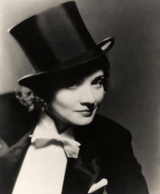 woman in top hat and tuxedo