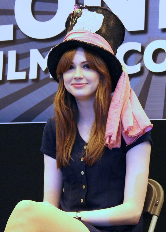 woman in top hat at event