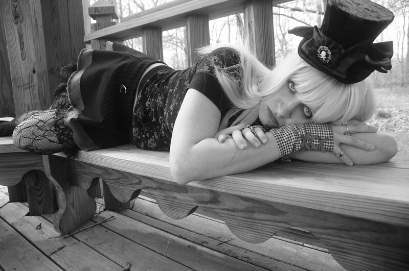 Woman in Top Hat Lying