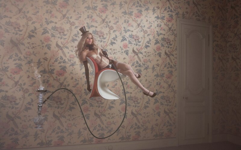 woman in top hat on chair