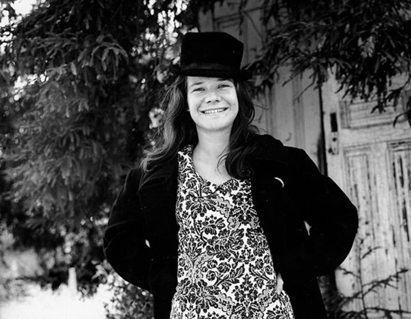 woman in top hat smiling