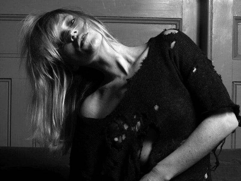 woman in torn sweater