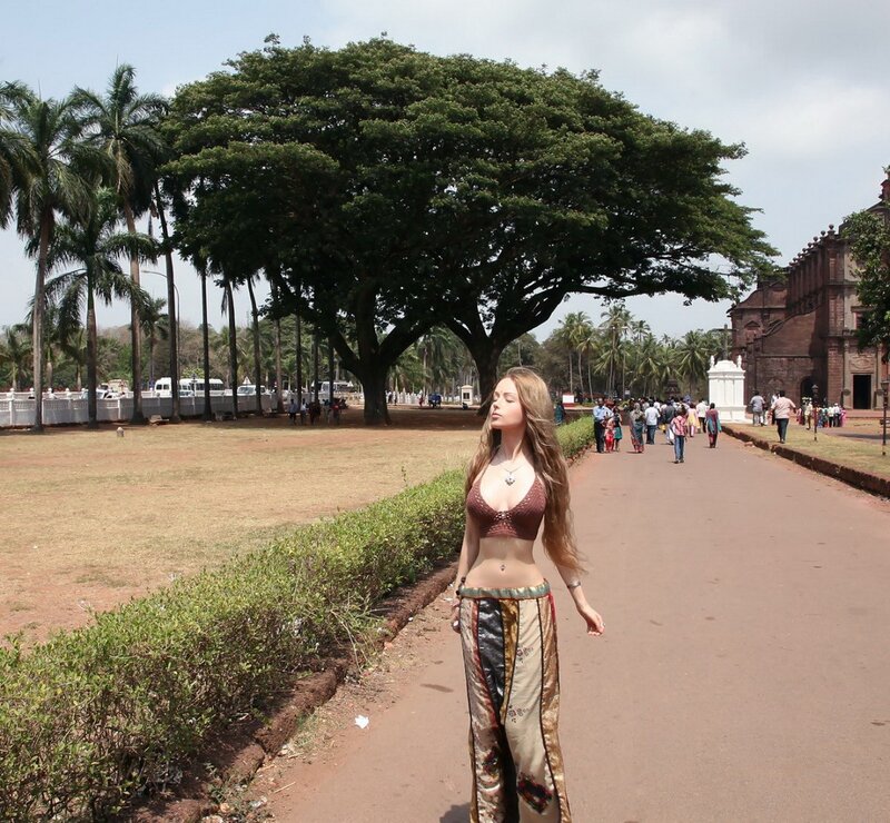 Woman in traditional attire at a historic site