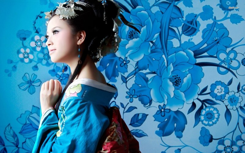 Woman in Traditional Attire — Blue, Serene, Photograph, Flower Pattern
