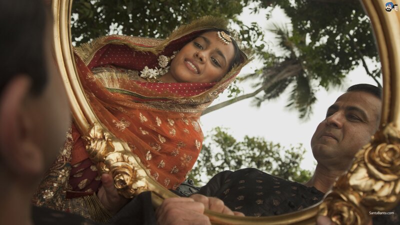 woman in traditional attire reflected