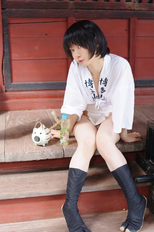 Woman in traditional attire sitting on steps