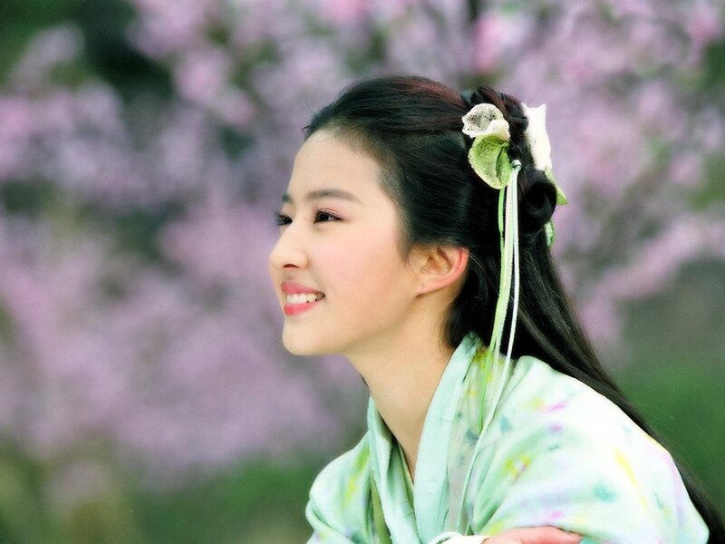 woman in traditional attire smiling