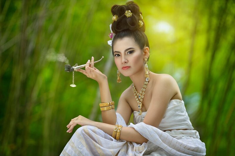 Woman in Traditional Attire — White, Serene, Afternoon