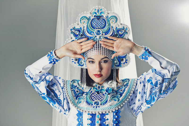 woman in traditional blue and white costume