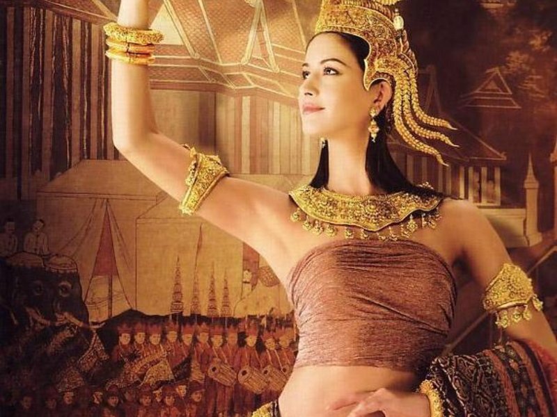 Woman in Traditional Costume — Gold, Dramatic, Photograph