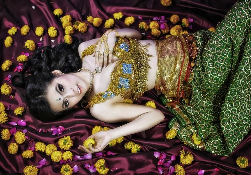 Woman in Traditional Costume — Green, Dramatic, Photograph
