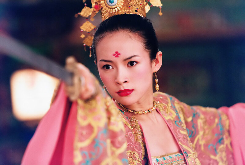 woman in traditional costume holding sword
