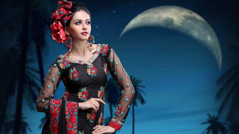 woman in traditional dress at night
