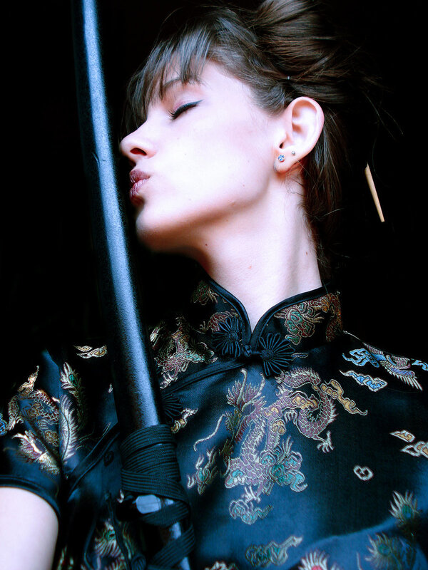 Woman in Traditional Dress — Black, Dramatic, Photograph