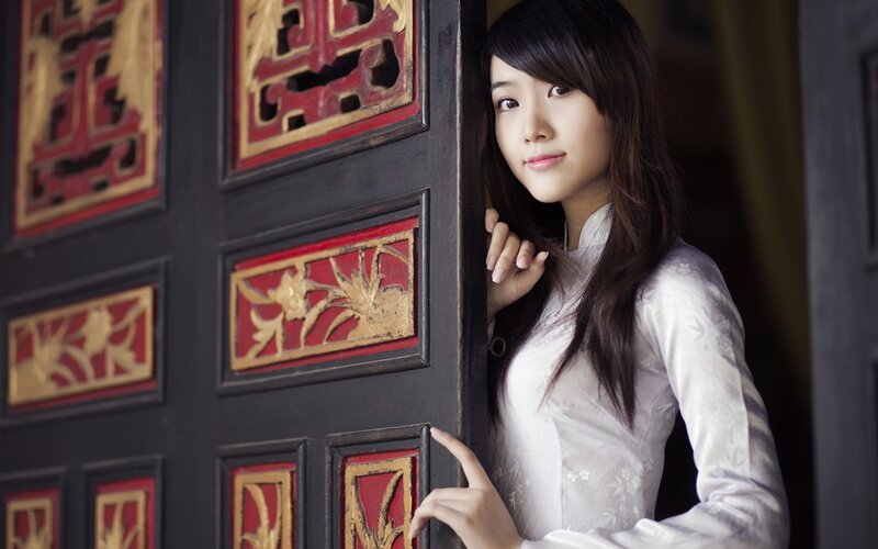 woman in traditional dress by door