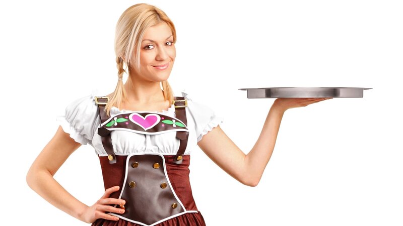 woman in traditional dress holding tray