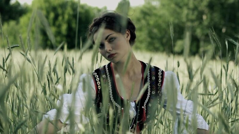 woman in traditional dress in field