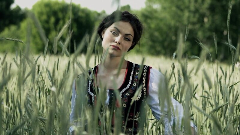 woman in traditional dress in field