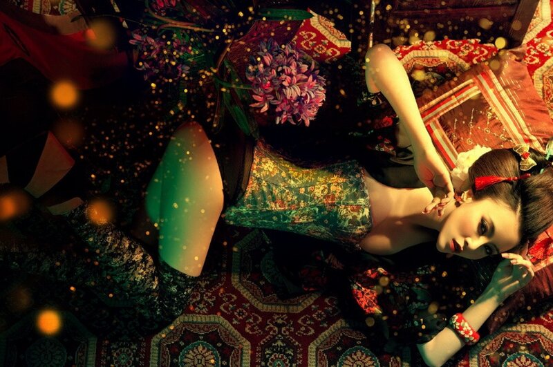 woman in traditional dress lying on rug