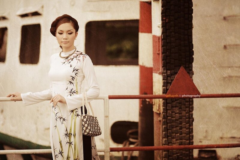 Woman in traditional dress on a boat