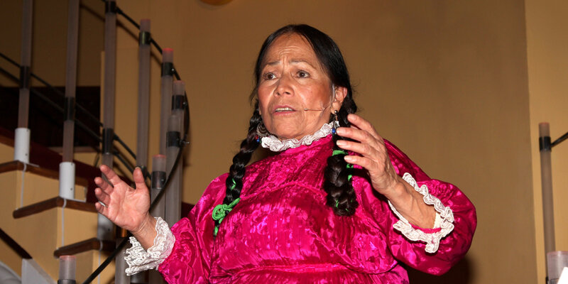 Woman in traditional dress speaking