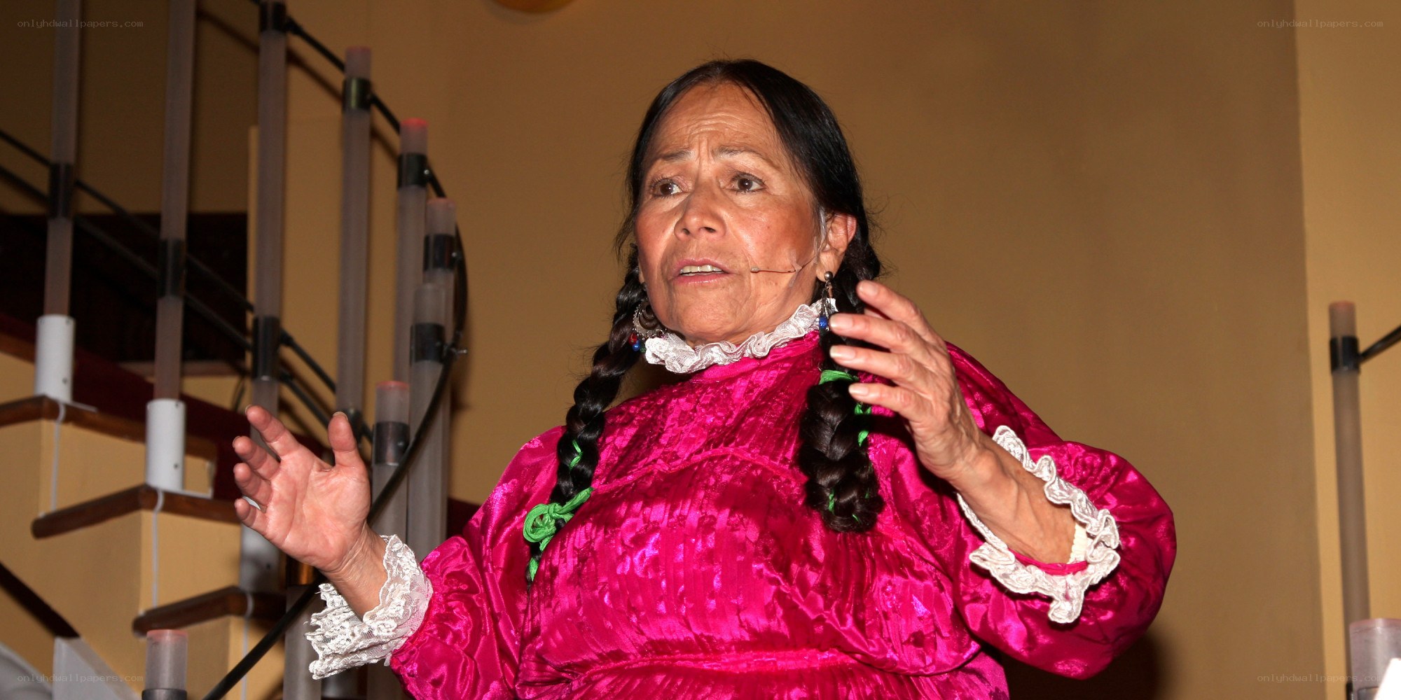Woman in traditional dress speaking
