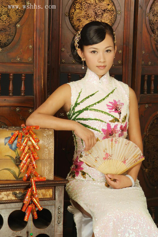 Woman in traditional dress with fan