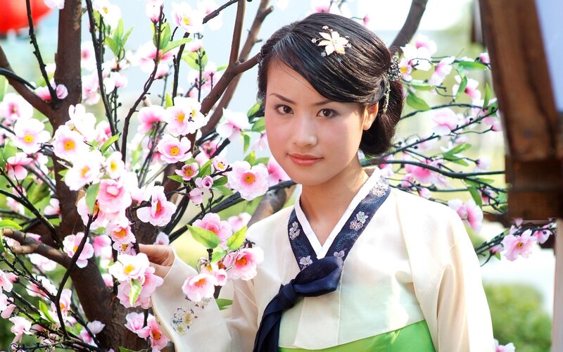 woman in traditional dress with flowers