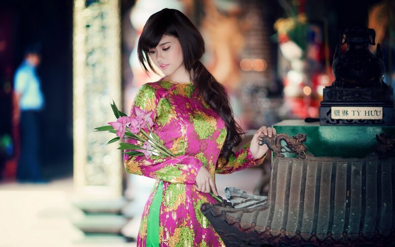 Woman in traditional dress with flowers