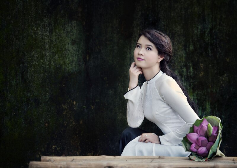 woman in traditional dress with lotus