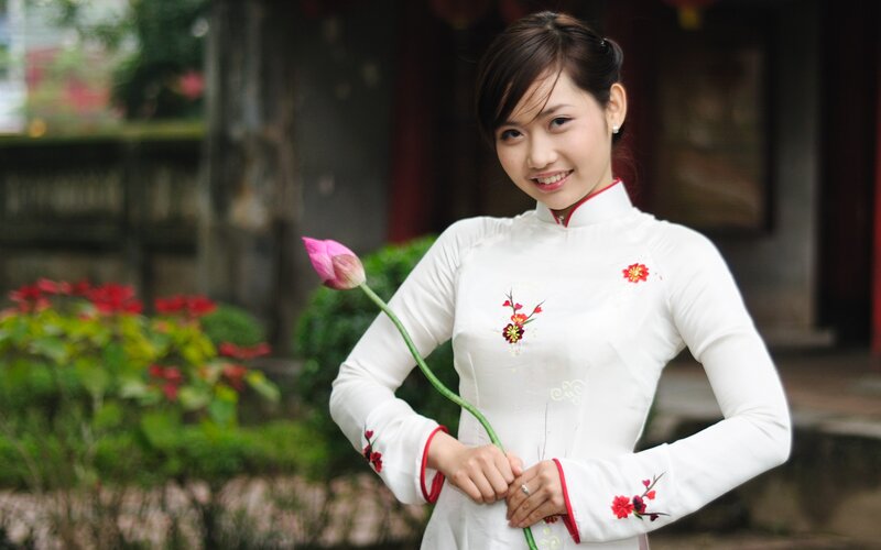Woman in traditional dress with lotus