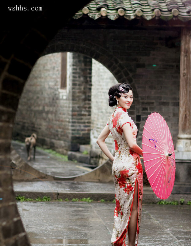Woman in traditional dress with parasol