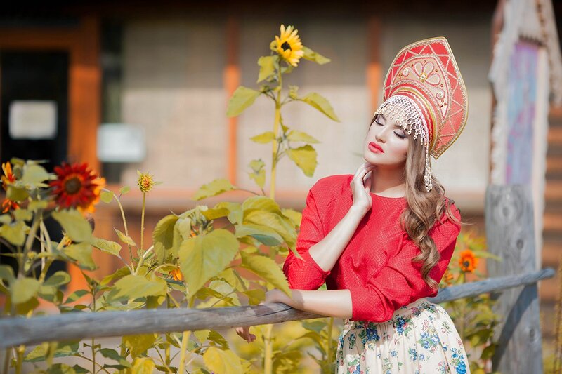 Woman in Traditional Hat — Red, Serene