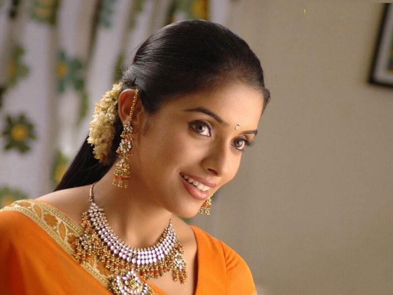 woman in traditional orange sari