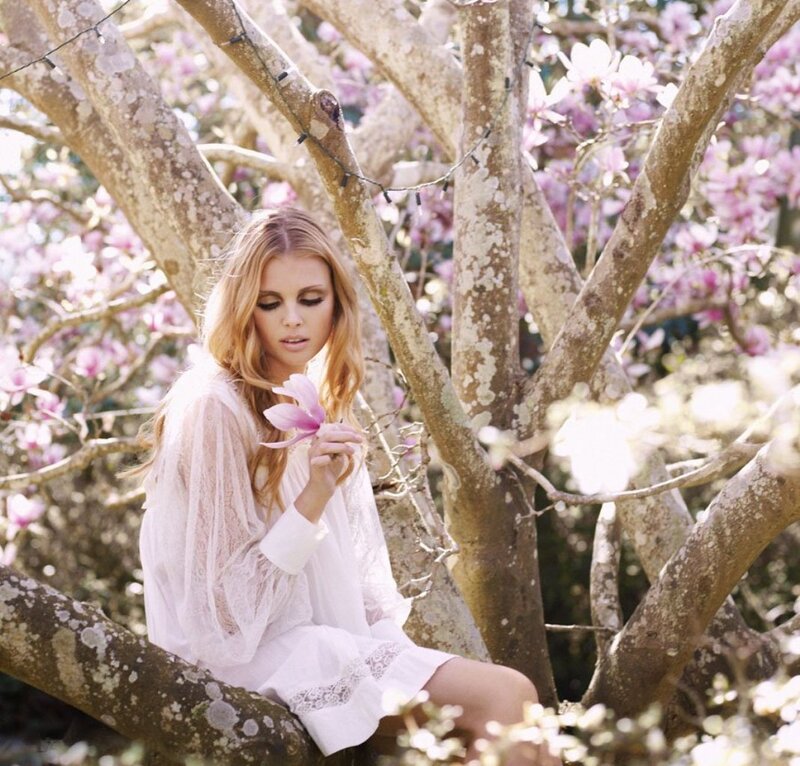Woman in Tree with Flower