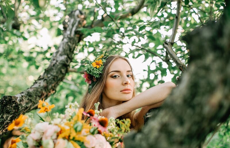 Woman in Tree with Flowers
